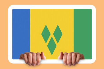 Hands holding a white frame with Saint Vincent And G. flag, independence day idea, celebration 