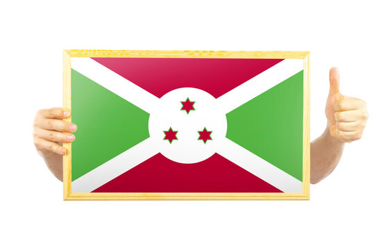 Hands holding a frame with Burundi flag, approvement or success in Burundi, independence day idea