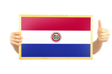 Hands holding a frame with Paraguay flag, approvement or success in Paraguay, independence day 