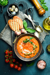 Pumpkin carrot cream soup with pumpkin seeds and cream. In a bowl. Healthy food concept. Close up.