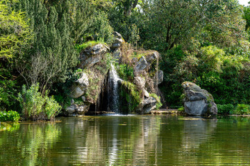 Pond and Cascade in the Bagatelle Park at springtime. The Park is located in Boulogne-Billancourt...