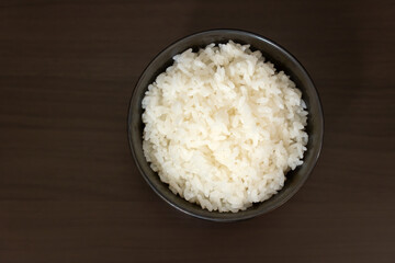 Cooked rice on a wooden table