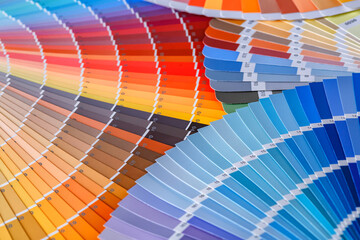 Color wheel for choosing paint tone.Painter and decorator work table, color swatches