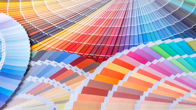 Color wheel for choosing paint tone.Painter and decorator work table, color swatches