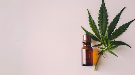 Cannabis essential oil in a small bottle with cannabis leaves. 