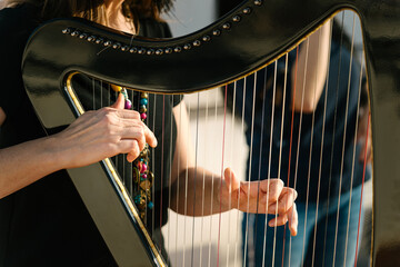 Harpist and vocalist doing a musical show on the roof