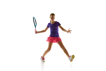 Sporty teenager, tennis player in vibrant comfortable uniform during game in motion against white studio background. Concept of professional sport, movement, tournament, action. Ad