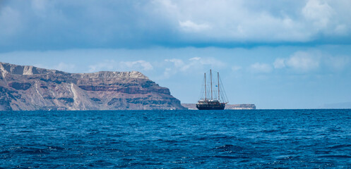Sailing to Thirasia island, part of the Satorini caldera archipelago, Cyclades Islands, South...