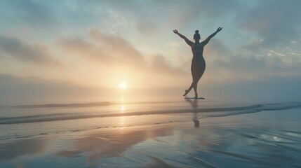 A morning yoga session on a misty beach as the sun rises.