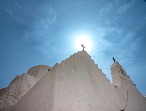 The white whased facade of a traditional Greek orthodox chuch in Mykonos, Cyclades Islands, Aegean Sea, Greece