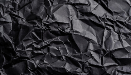 Black crumpled paper texture background with empty space for text