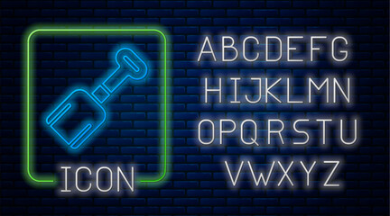 Glowing neon Shovel toy icon isolated on brick wall background. Neon light alphabet. Vector