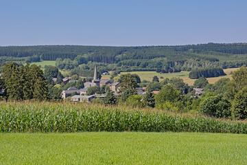 Naklejka premium Old village of Tillet with traditional houses and church in the hills of Ardennes 