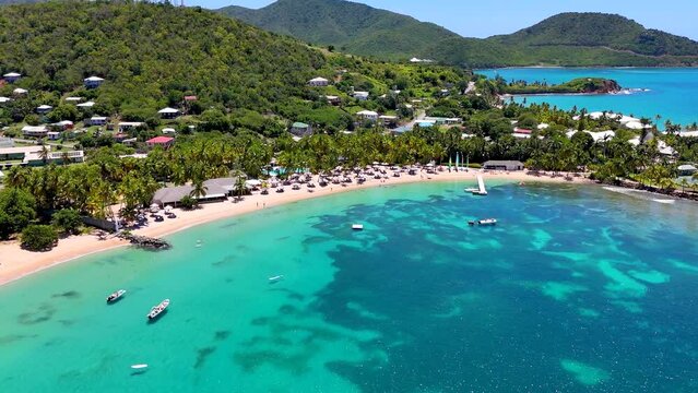 Panoramic aerial view of the beautiful Morris Bay Beach with palm trees and emerald see, Antigua and Barbuda, Caribbean