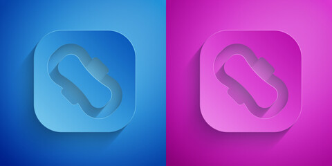 Paper cut Menstruation and sanitary napkin icon isolated on blue and purple background. Feminine hygiene product. Paper art style. Vector