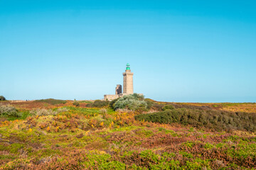 Fototapeta na wymiar Lighthouse of the French Brittany. Phare du Cap Fréhel. In Brittany, France