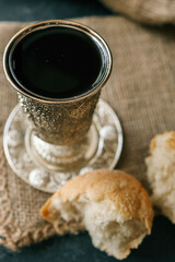 Cup with wine and bread close-up, Christian communion