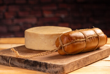 Cheese, details of beautiful and delicious cheese on rustic wooden surface, selective focus.