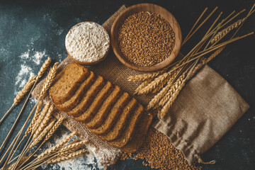 Sliced rye bread on cutting board. Whole grain rye bread with seeds