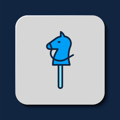Filled outline Toy horse icon isolated on blue background. Vector