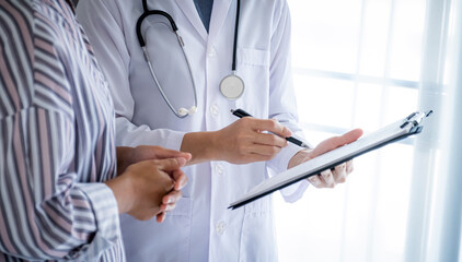 Doctors report health examination results and recommend medication to patients, medical checkup concept