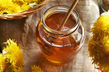 A jar of dandelion flower syrup