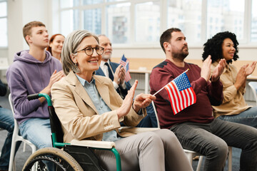 Group of multiracial US citizens, senior woman in wheelchair meeting with presidential candidate