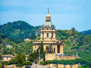 Tempio di Cristo Re church hight on a hill in Messina, Sicily, Italy. In addition to grand architecture it offers magnificent view of the city and strait of Messina