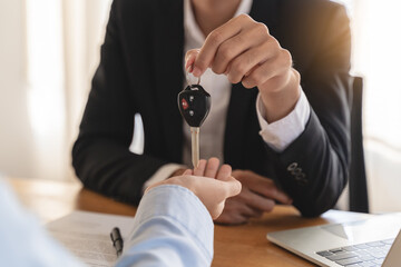 Business car rental company service, Close up hand of agent dealer giving, holding car key to...