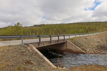 View of Rajajoosepintie road in cloudy spring weather, Lapland, Finland.