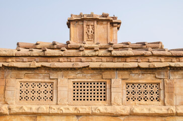 Ornately sculpted windows at Shivalaya or Ladkhan temple at Durga Temple complex in Aihole, Bagalkot, Karnataka, India.
