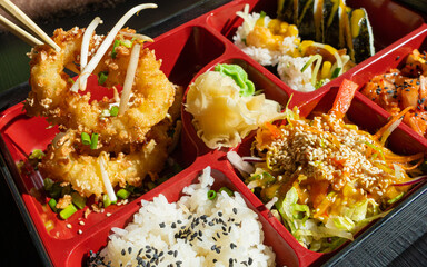 Japanese Lunch Closeup, Bento Box Macro, Deep-Fried Squid Rings, Sushi Rolls, Salad, Rice, Pickles