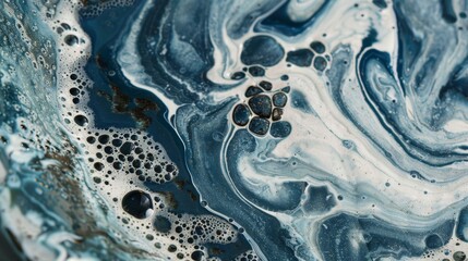 Naklejka premium A ceramic plate showcasing a unique marbling effect achieved through the swirling technique..