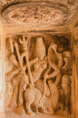 Sculpture or carving of Durga Spearing Mahisha, Ravana padi Cave Temple, Aihole, Badami, Karnataka, India.