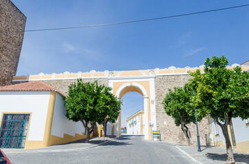 Gate in the wall of Avis, picturesque medieval village, in the Alentejo region. Portugal.