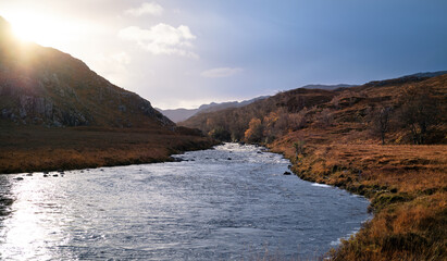 The River Gruinard flowing past the summit of Carn nan Con-easan on the left and Creag nam Bord on the right in the Scottish Highlands, Scotland in the UK.