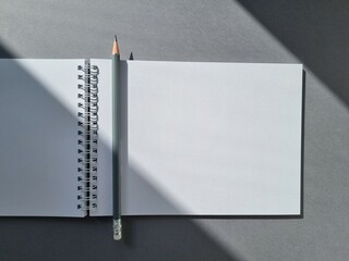 Open notebook and pencil