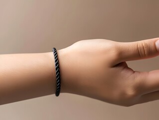 Black bracelet on hand mockup, close up, on neutral background