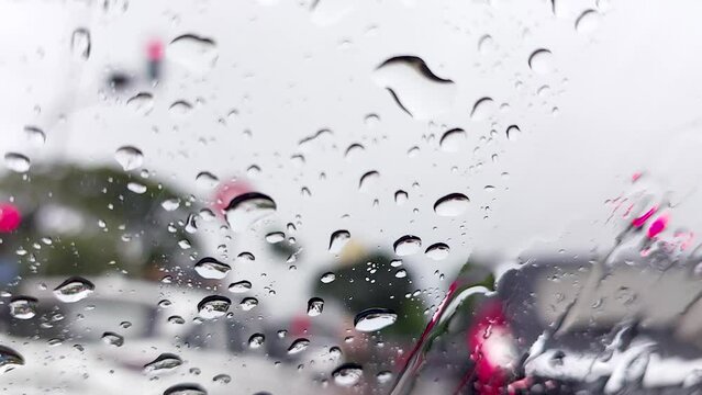 Raindrops on front glass of the window car