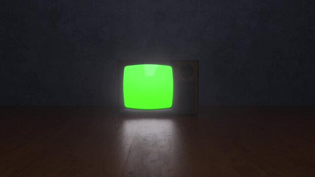 
Isolated old television. A television from the 80s with a green screen. Old retro television technology. Zoom in focused.