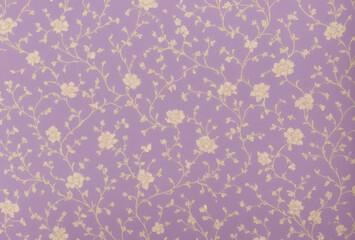 Aged floral wallpaper with Victorian charm, composed of subtle lavender and cream flowers.. AI generated.
