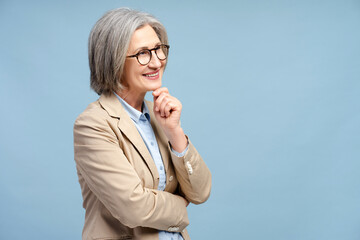 Smiling senior business woman wearing eyeglasses looking away, thinking isolated - obrazy, fototapety, plakaty