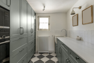 Baking and storage area in a kitchen with a checkerboard floor