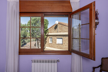 French style wood and glass double hung window with white curtains, fuchsia interior room walls and...