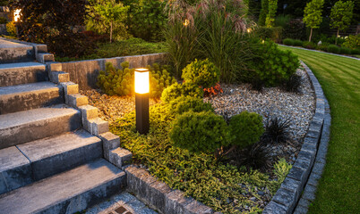 Fototapeta premium LED Outdoor Light Post in a Beautiful Residential Rockery Garden