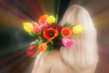 Naklejka premium Behind the blonde's back is a bouquet of flowers on a blurred background of optical smoke rays. Conceptual women's beauty and health.