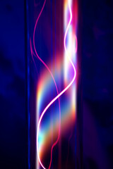 A glass tube with red and blue light from the gas.