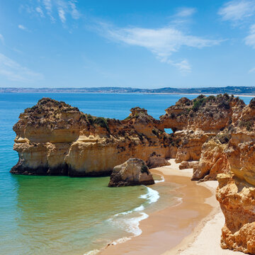 Top view on sandy beach Dos Tres Irmaos (Portimao, Alvor, Algarve, Portugal).
