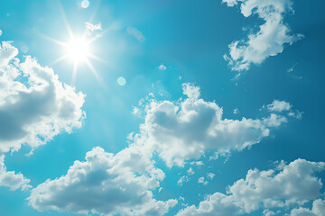 Bright sun shining through fluffy white clouds in a clear blue sky on a sunny day