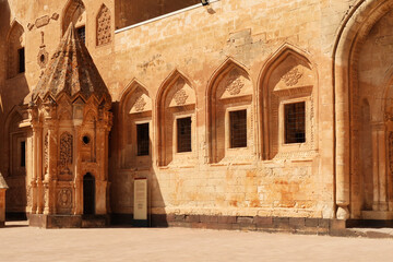 Ottoman tomb next to a row of barred windows in the second court inside the Ishak Pasha Palace,...